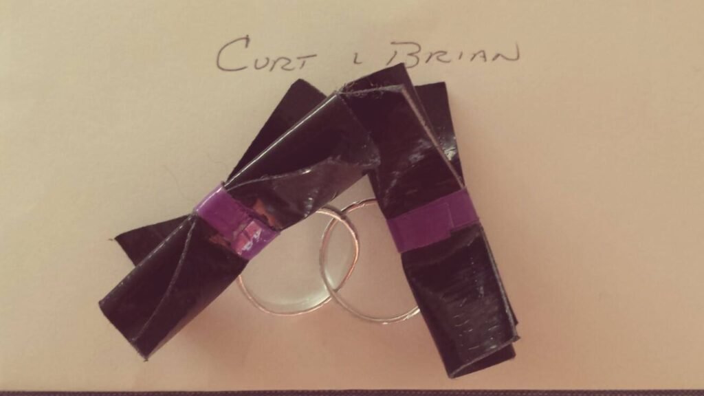 This is a picture of our wedding rings that my niece made for us out of duct tape. She was really intomaking crafts out of duct tape at the time.